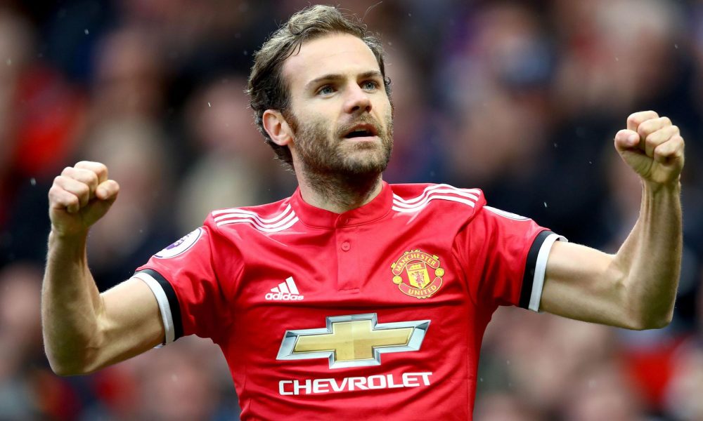 Juan Mata celebrating in Manchester United home kit