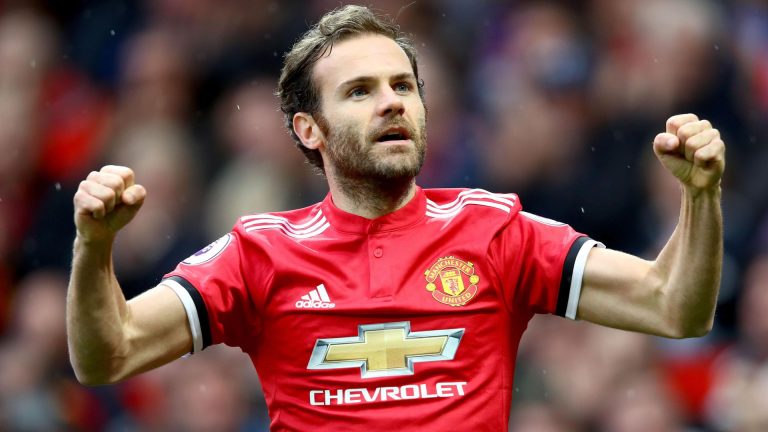 Juan Mata celebrating in Manchester United home kit