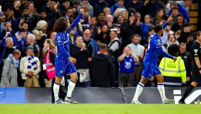 Marc Cucurella celebrates after scoring vs Manchester United