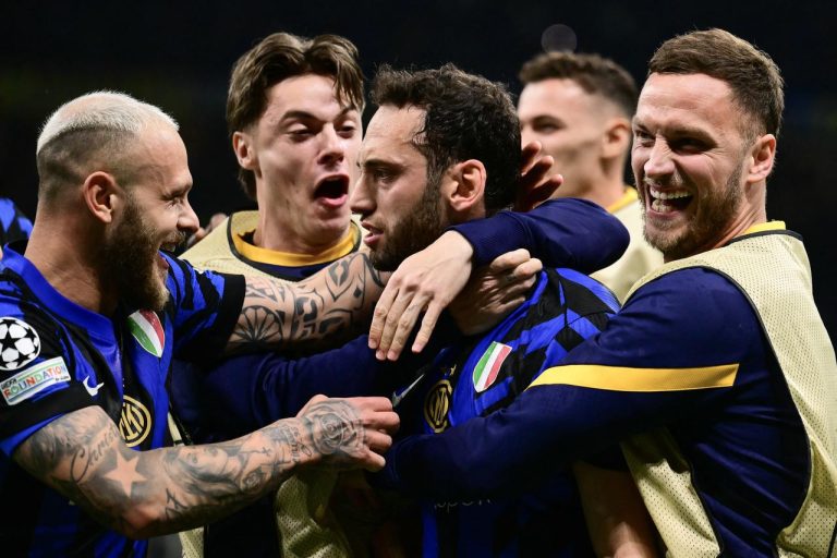 Hakan Calhanoglu celebrating with Inter Milan teammates
